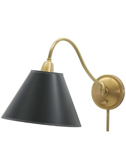 Hyde Park Swing-Arm Wall Lamp with Black Parchment Shade in Weathered Brass.